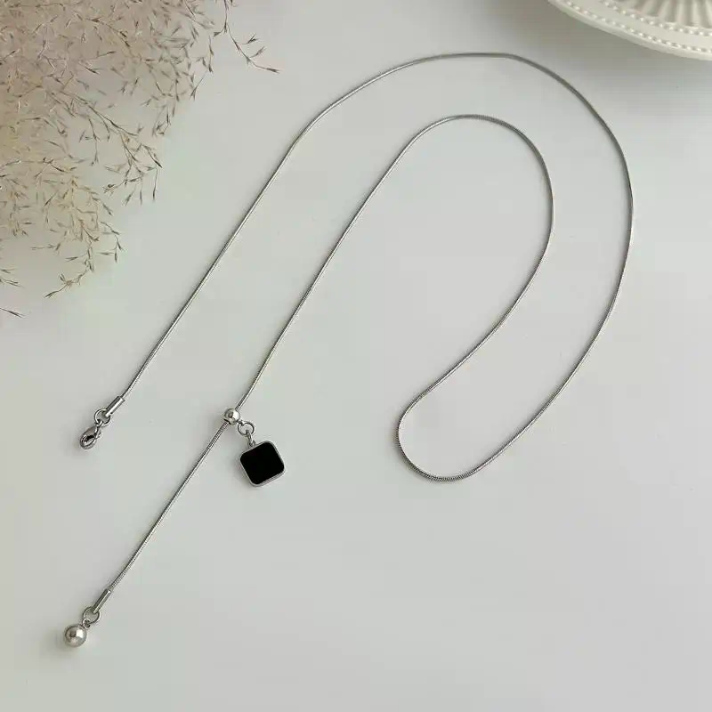 سلسلة ظهر لامعة باللؤلؤ للنساء - مراجعة Body Jewelry For Backless Dress وسعره
