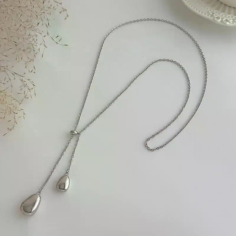 سلسلة ظهر لامعة باللؤلؤ للنساء - مراجعة Body Jewelry For Backless Dress وسعره